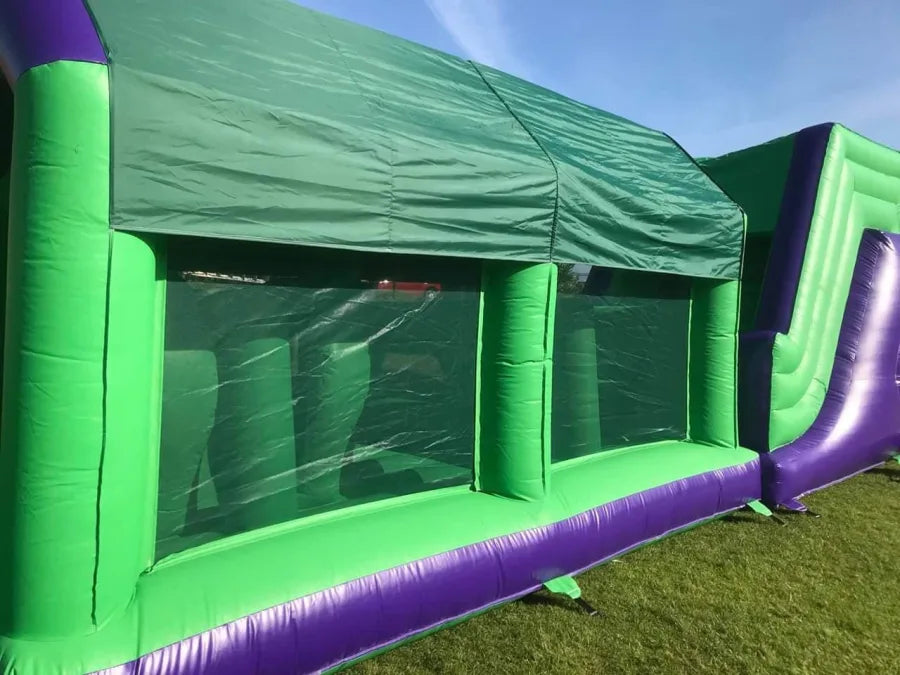 2 Part Obstacle - 8ft Drop Slide - Netted Walls - (Green and Purple) 45x10x12ft